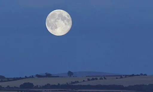 A Harvest Moon lights up the landscape