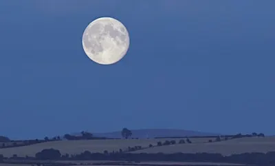 A Harvest Moon lights up the landscape