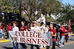 Herbert Wertheim College of Business Walks in the Homecoming Parade!