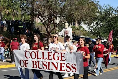 Herbert Wertheim College of Business Walks in the Homecoming Parade!