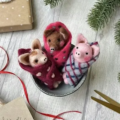 Needle Felted Christmas Pigs in Blankets decorations.